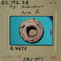 Ancient pottery with intricate designs on display.