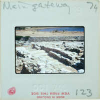 A photograph of an old stone structure, possibly ruins, with a date stamp on the bottom right corner.