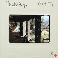 A vintage photograph of a wooden structure with columns, taken on October 17, 1977.