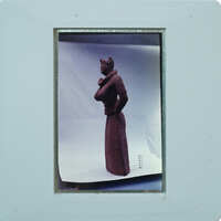 Detail of almost complete terracotta figurine from the side minus right arm.