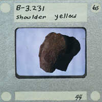 A close-up photograph of a rock with labels, including "B-3261" and "Shoulder yellow."