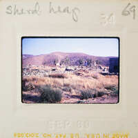 A vintage photo of a barren landscape with sparse vegetation and distant mountains, dated September 1969.