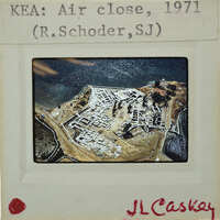 Aerial photograph of a fortified island with buildings and structures, taken in 1971 by R. Schroeder, SJ.