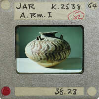 A photograph of a decorative jar (K.2538) with an intricate pattern.