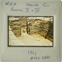 Old stone ruins with visible layers and shadows, possibly part of an ancient structure.