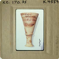 Ancient Greek vase with intricate patterns and designs.
